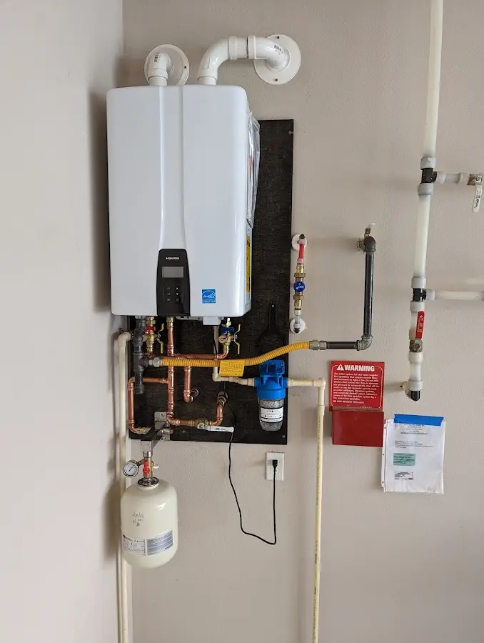 Professional plumber installing copper piping in a San Carlos Park home